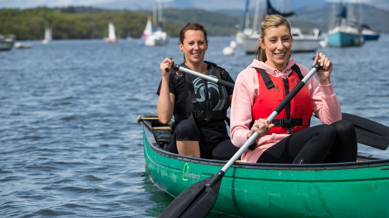 Two people canoeing on the water